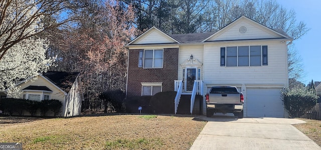 194 Goldleaf Dr, Hampton, GA 30228 - raised ranch featuring a front yard, concrete driveway, and an attached garage