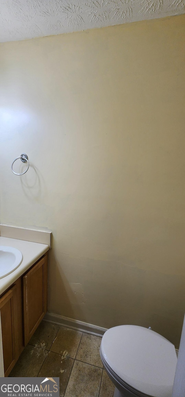194 Goldleaf Dr, Hampton, GA 30228 - bathroom with vanity, toilet, and baseboards