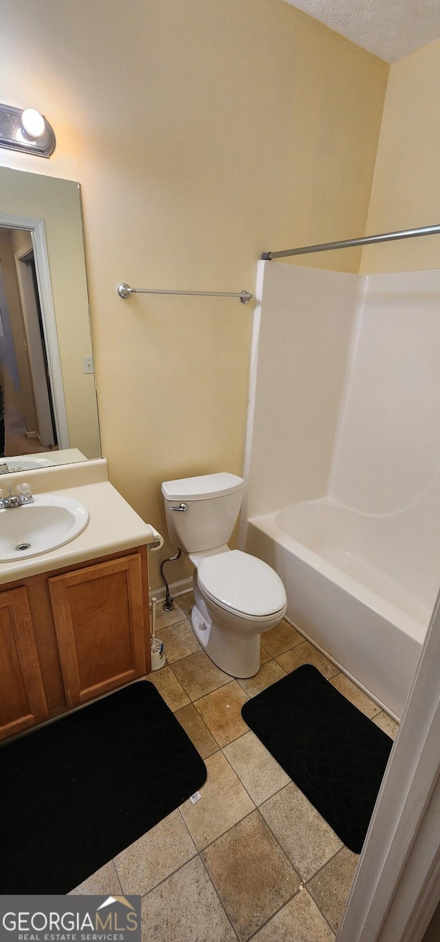 194 Goldleaf Dr, Hampton, GA 30228 - full bath featuring tile patterned floors, toilet, vanity, and bathtub / shower combination