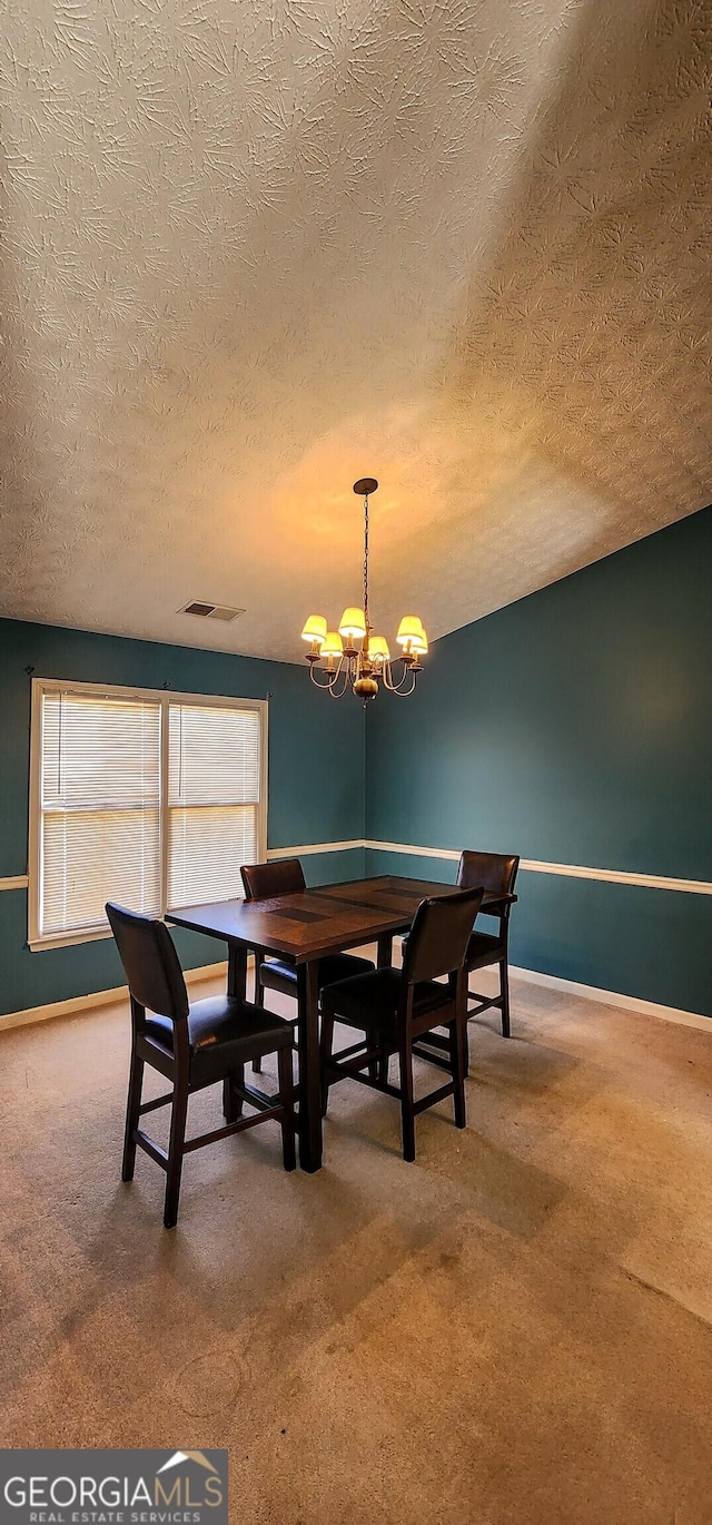 194 Goldleaf Dr, Hampton, GA 30228 - carpeted dining space featuring baseboards, visible vents, and a chandelier