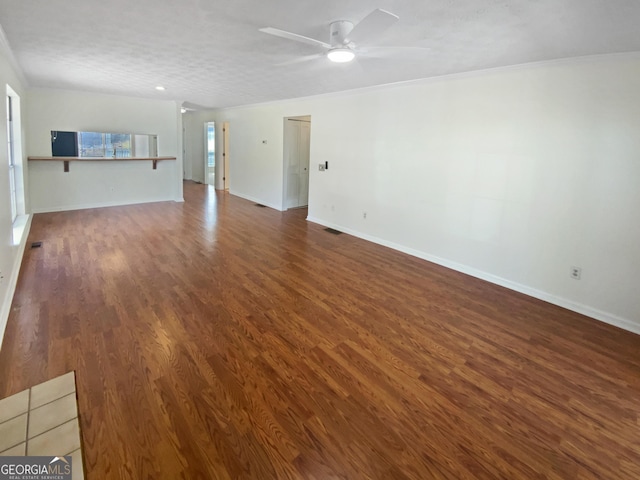 3705 Tradewinds Dr, Cumming, GA 30041 - unfurnished living room featuring visible vents, baseboards, ornamental molding, wood finished floors, and a ceiling fan