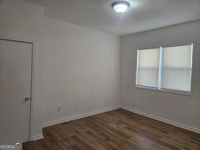 157 Knight St, Irwinton, GA 31042 - unfurnished room with dark wood finished floors and baseboards
