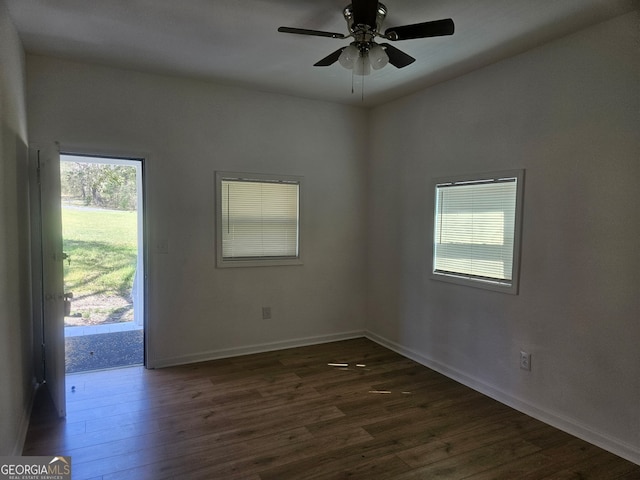 157 Knight St, Irwinton, GA 31042 - empty room featuring baseboards, dark wood-type flooring, and a ceiling fan