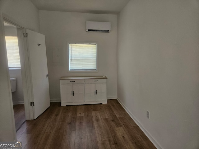 157 Knight St, Irwinton, GA 31042 - interior space featuring a wall mounted AC, baseboards, and wood finished floors