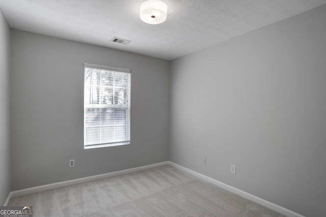 1579 Eastern Sunrise Ln, Decatur, GA 30034 - unfurnished room with a textured ceiling, baseboards, visible vents, and light carpet