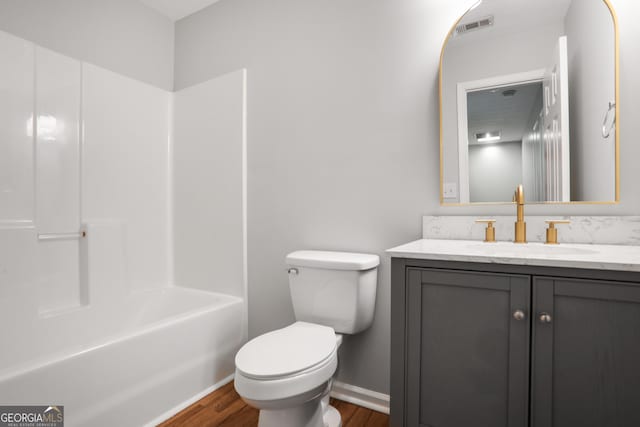 1579 Eastern Sunrise Ln, Decatur, GA 30034 - bathroom featuring visible vents, baseboards, toilet, wood finished floors, and vanity