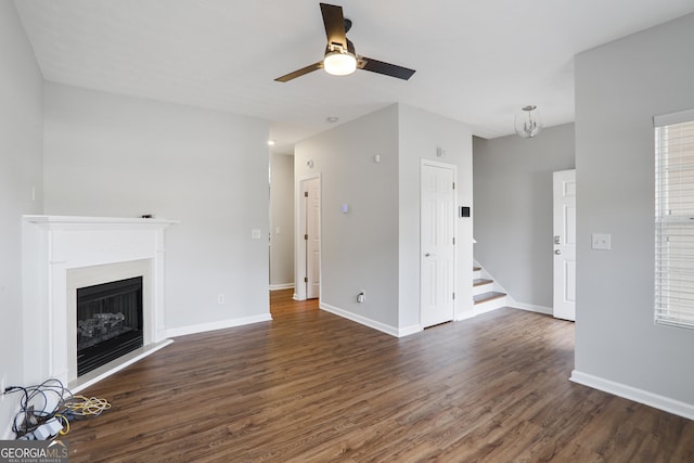 1579 Eastern Sunrise Ln, Decatur, GA 30034 - unfurnished living room featuring stairway, a ceiling fan, baseboards, dark wood finished floors, and a fireplace