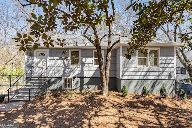 single story home with fence