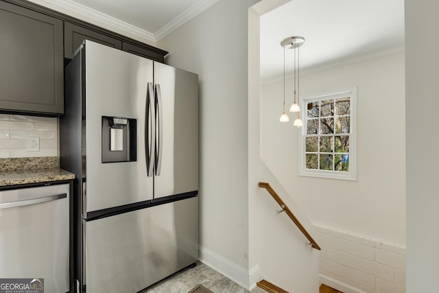 kitchen featuring ornamental molding, pendant lighting, light stone counters, and stainless steel appliances