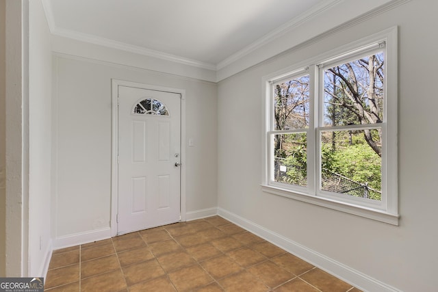 foyer entrance featuring ornamental molding, baseboards, and plenty of natural light