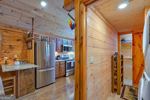 656 River Vista Dr, Dillard, GA 30537 - kitchen with stainless steel appliances, wood ceiling, wood walls, recessed lighting, and light wood-type flooring