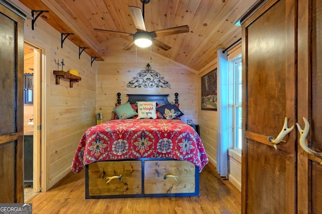 656 River Vista Dr, Dillard, GA 30537 - bedroom featuring wood ceiling, light wood finished floors, wooden walls, vaulted ceiling, and a ceiling fan