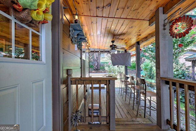 656 River Vista Dr, Dillard, GA 30537 - wooden deck with a ceiling fan and an outdoor bar