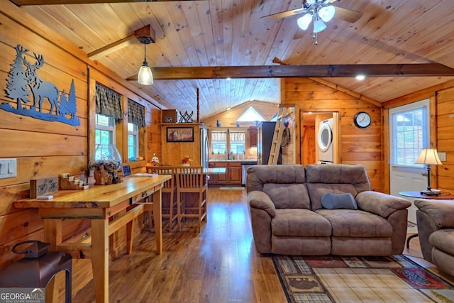 656 River Vista Dr, Dillard, GA 30537 - living room with stacked washing machine and dryer, wooden walls, hardwood / wood-style floors, a ceiling fan, and wooden ceiling
