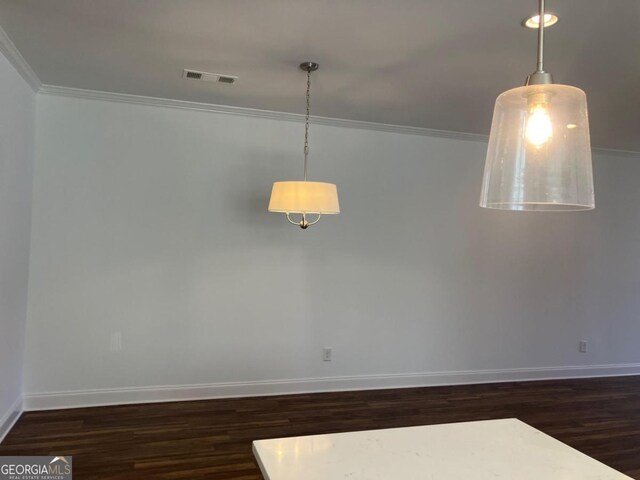 5099 Noble Village Way, Lilburn, GA 30047 - empty room with visible vents, crown molding, baseboards, and wood finished floors