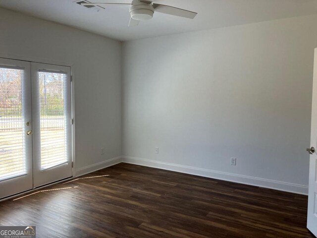 5099 Noble Village Way, Lilburn, GA 30047 - unfurnished room featuring french doors, plenty of natural light, visible vents, and dark wood-style flooring