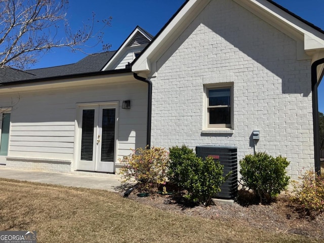 5099 Noble Village Way, Lilburn, GA 30047 - rear view of house featuring cooling unit and french doors