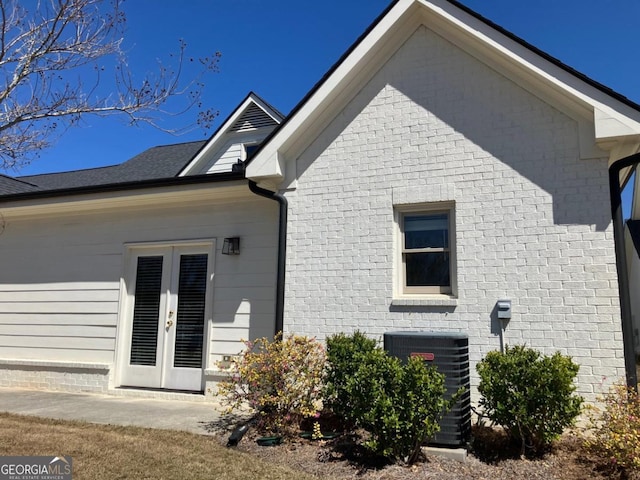 5099 Noble Village Way, Lilburn, GA 30047 - back of house with central AC unit and french doors