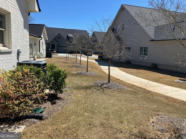 5099 Noble Village Way, Lilburn, GA 30047 - view of yard featuring central air condition unit