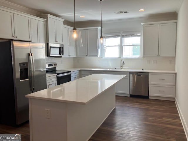 5099 Noble Village Way, Lilburn, GA 30047 - kitchen featuring tasteful backsplash, visible vents, a center island, stainless steel appliances, and a sink