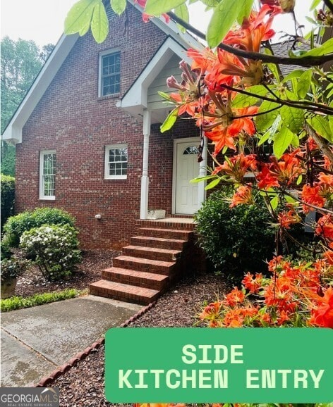 3550 Gravitt Rd, Cumming, GA 30040 - property entrance with brick siding