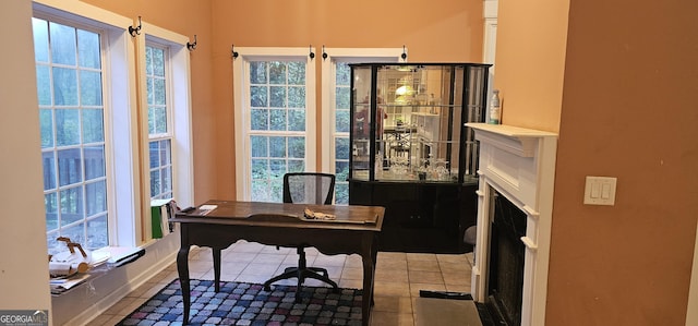office area with tile patterned floors