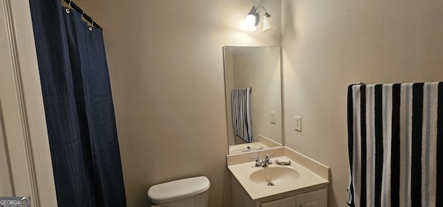 full bathroom featuring toilet and vanity