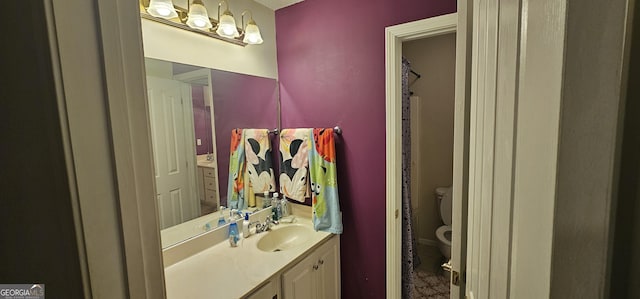 full bathroom featuring toilet and vanity