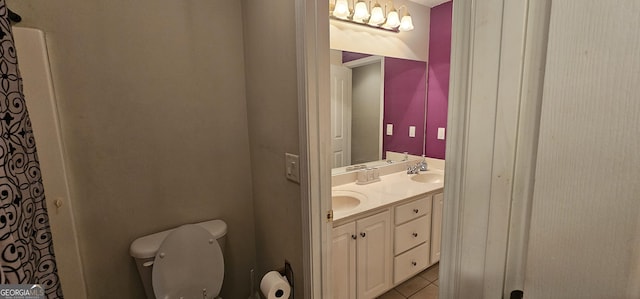 full bath featuring tile patterned flooring, a sink, double vanity, and toilet