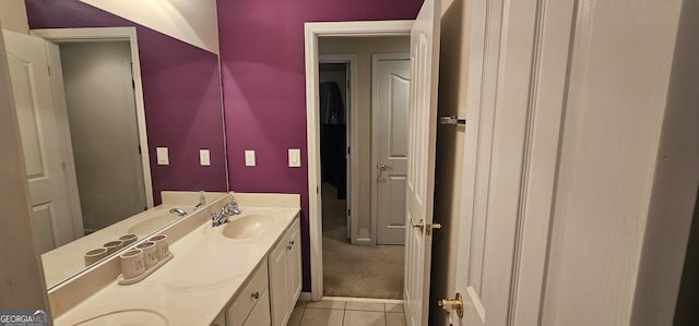 bathroom featuring tile patterned flooring and vanity