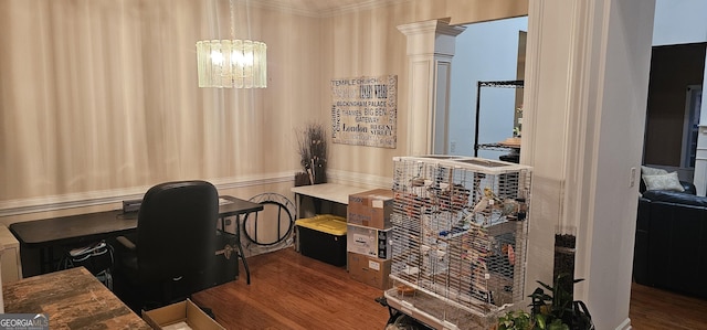 office area with a chandelier, decorative columns, ornamental molding, and wood finished floors