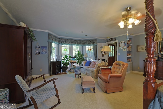 living room with crown molding, a ceiling fan, baseboards, and carpet floors