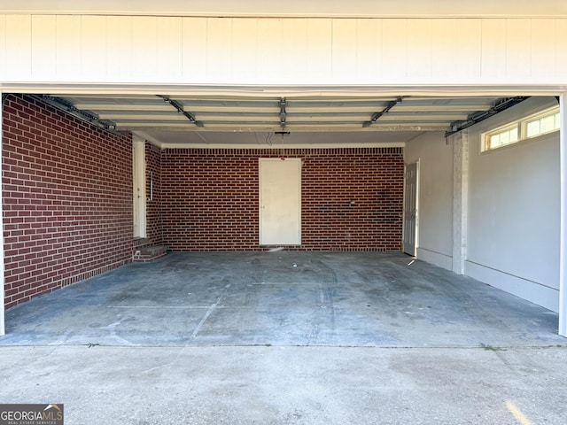 garage with concrete driveway
