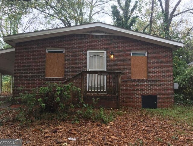 view of front of home featuring brick siding
