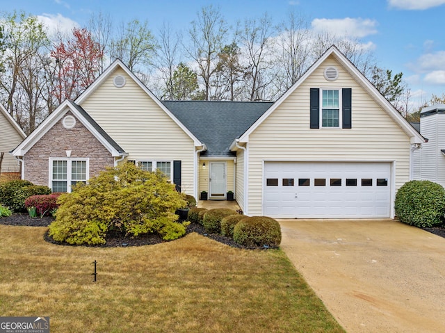 455 Ellesmere Way, Buford, GA 30518 - traditional home with an attached garage, a shingled roof, a front lawn, and concrete driveway