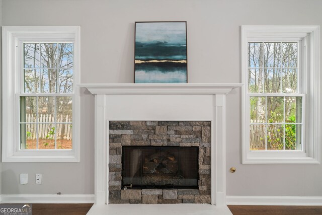 455 Ellesmere Way, Buford, GA 30518 - room details featuring a stone fireplace and baseboards
