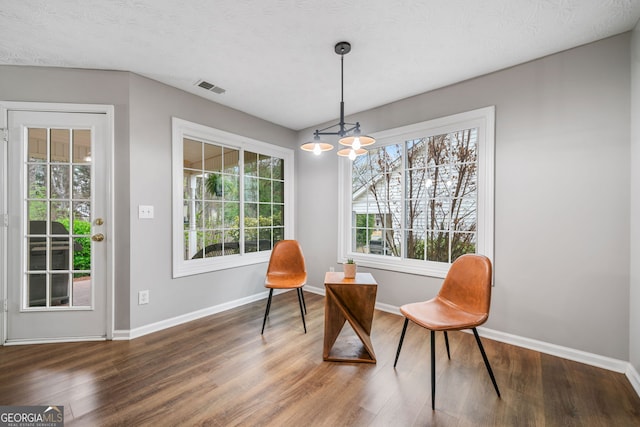 455 Ellesmere Way, Buford, GA 30518 - sitting room featuring wood finished floors, a textured ceiling, baseboards, visible vents, and an inviting chandelier