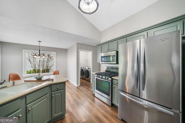 455 Ellesmere Way, Buford, GA 30518 - kitchen with green cabinets, washing machine and clothes dryer, stainless steel appliances, and lofted ceiling