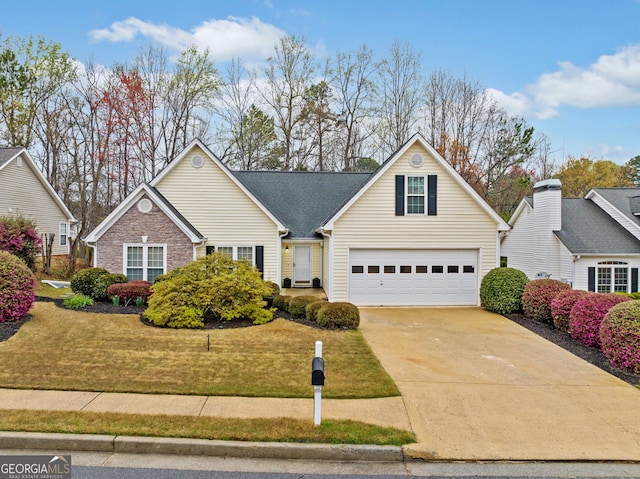 455 Ellesmere Way, Buford, GA 30518 - traditional-style home with a front yard, a garage, and concrete driveway