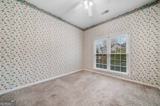 455 Ellesmere Way, Buford, GA 30518 - carpeted empty room with a textured ceiling, visible vents, baseboards, ceiling fan, and wallpapered walls