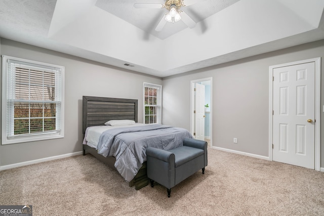 455 Ellesmere Way, Buford, GA 30518 - carpeted bedroom featuring a ceiling fan, a raised ceiling, baseboards, and visible vents