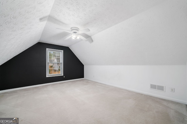 455 Ellesmere Way, Buford, GA 30518 - bonus room with a textured ceiling, visible vents, carpet, ceiling fan, and lofted ceiling