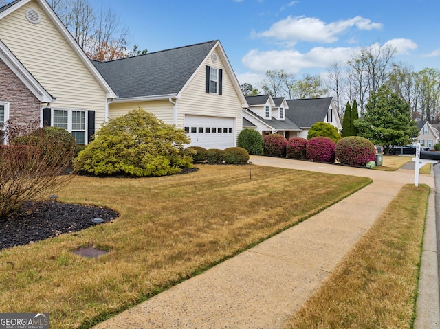 455 Ellesmere Way, Buford, GA 30518 - view of side of property with driveway, a garage, roof with shingles, and a yard