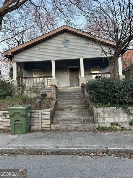 view of front of property featuring covered porch