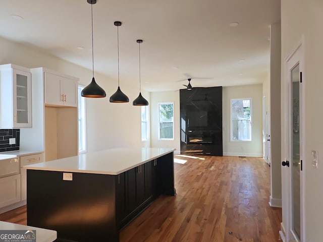 721 Cascade Ave SW, Atlanta, GA 30310 - kitchen with a ceiling fan, white cabinets, healthy amount of natural light, and wood finished floors