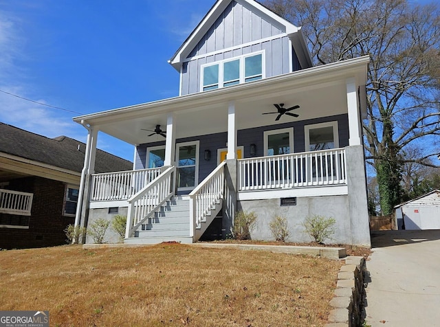 721 Cascade Ave SW, Atlanta, GA 30310 - view of front facade featuring ceiling fan, board and batten siding, covered porch, a front lawn, and stairway