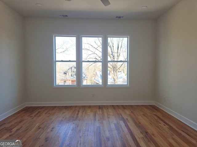 721 Cascade Ave SW, Atlanta, GA 30310 - spare room with healthy amount of natural light and wood finished floors
