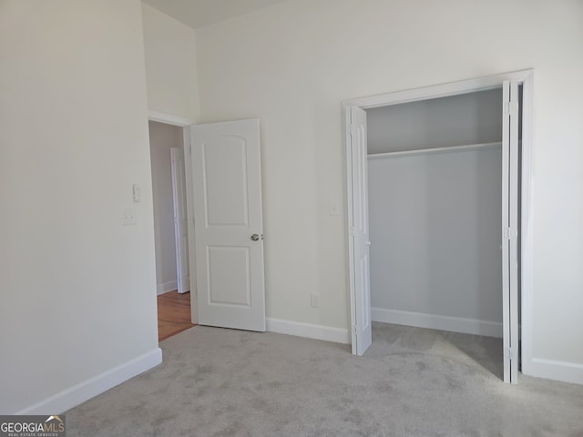721 Cascade Ave SW, Atlanta, GA 30310 - unfurnished bedroom featuring carpet flooring and a closet