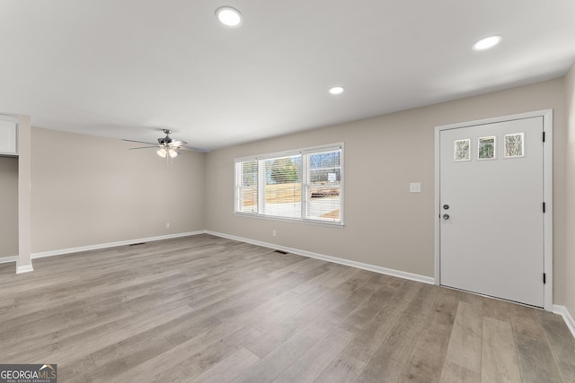 unfurnished living room featuring recessed lighting, ceiling fan, baseboards, and light wood-type flooring