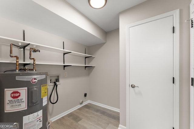 laundry room featuring light wood finished floors, electric water heater, hookup for a washing machine, electric dryer hookup, and laundry area